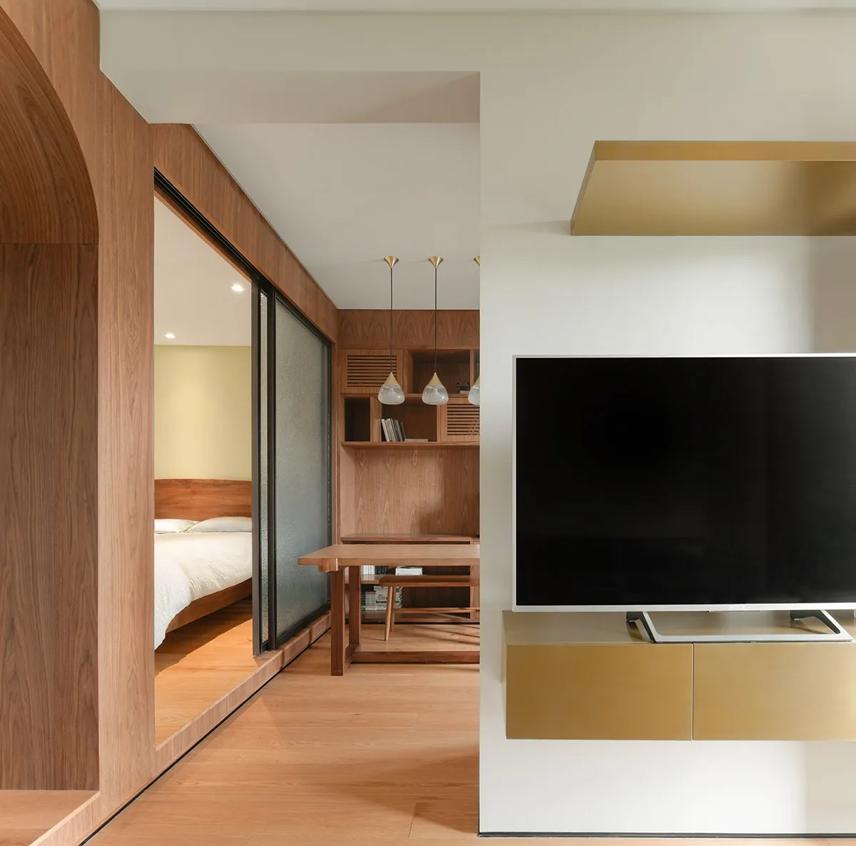 Modern residential interior with wooden furniture and minimalist design elements.