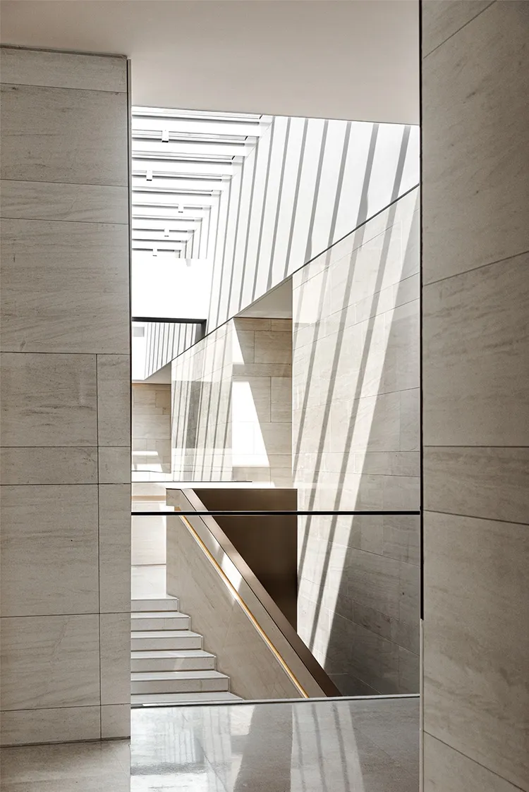 A modern interior design featuring a marble curtain wall.