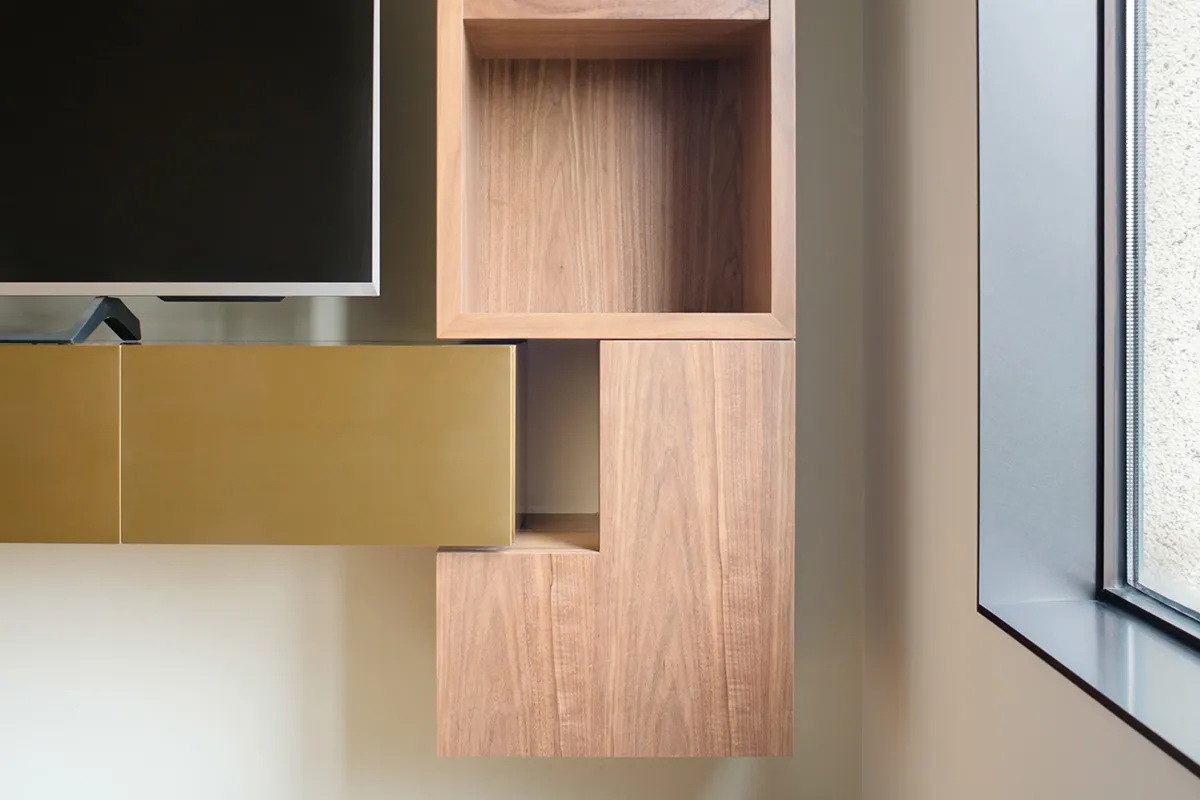 A modern interior design featuring a wooden accent wall and floating shelves.