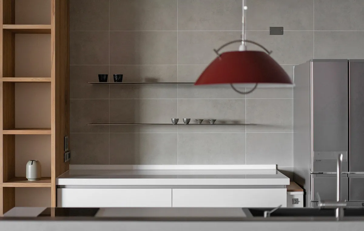 Modern kitchen with industrial design elements and a concrete finish.