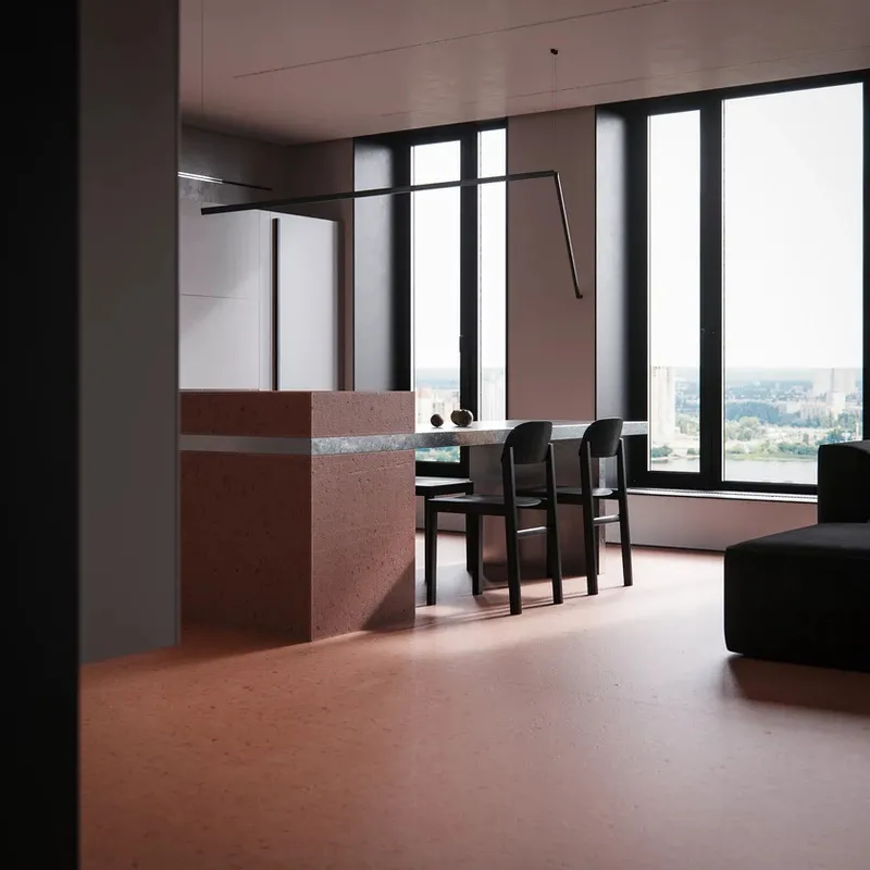 A modern kitchen with concrete and marble countertops and flooring, featuring bar stools and a view of the cityscape outside.