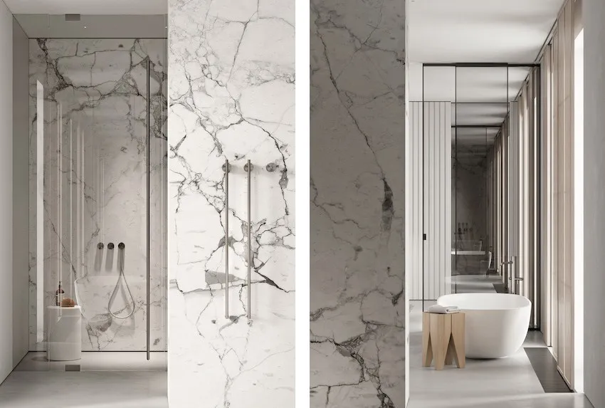 Modern bathroom featuring marble walls and floor, with a white freestanding bathtub and minimalist design elements.
