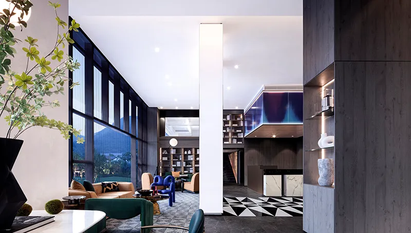 Modern hotel lobby with concrete columns and floor, featuring contemporary furniture and large windows.