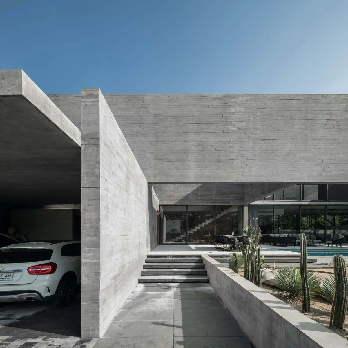 Modern house with a concrete exterior and a carport