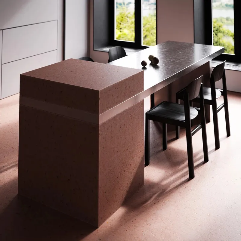A minimalist, modern kitchen featuring concrete countertops and minimalist design.