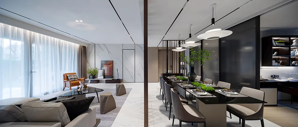 Modern-designed dining and living room featuring marble countertops, concrete walls, and steel accents.