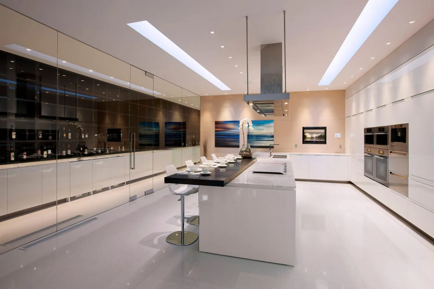 Modern kitchen with marble countertops and minimalist design.