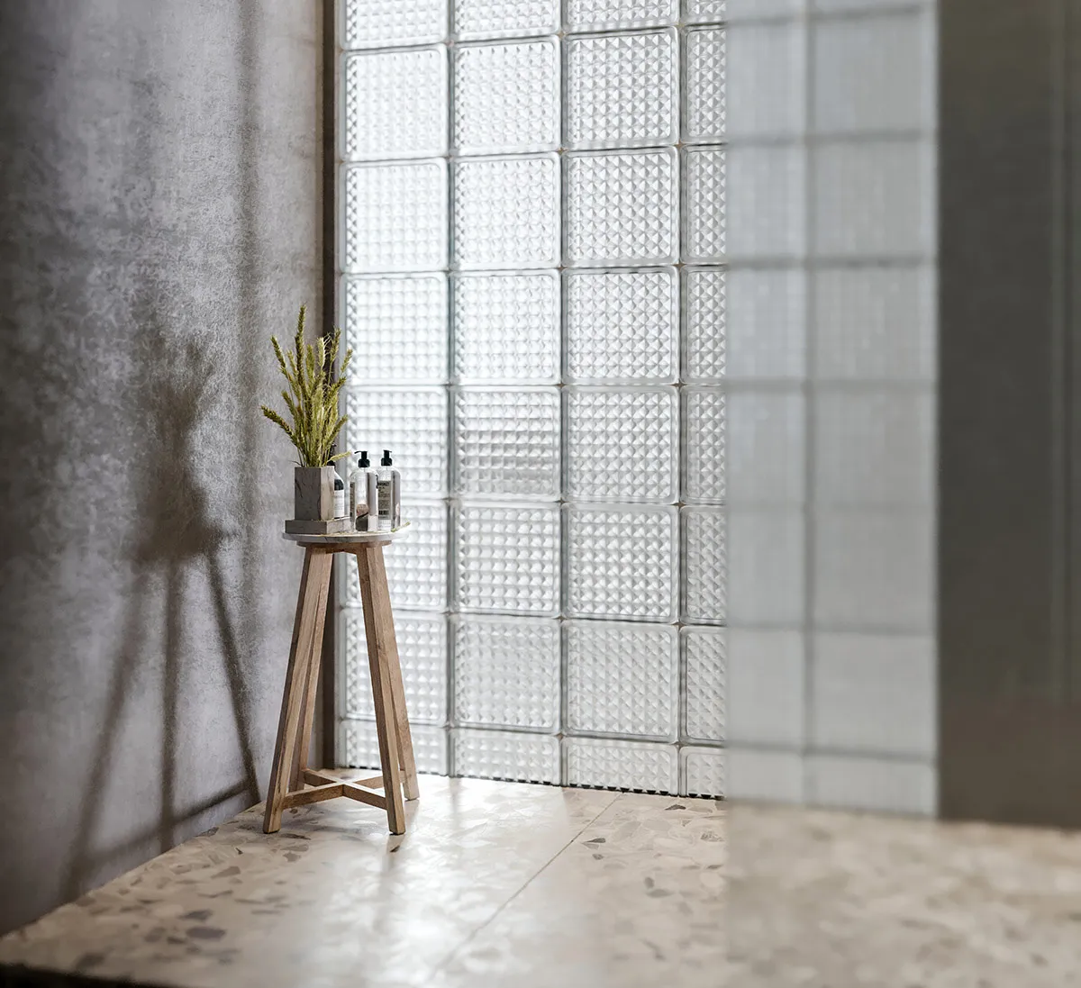A minimalist bathroom featuring marble flooring and glass tiles.