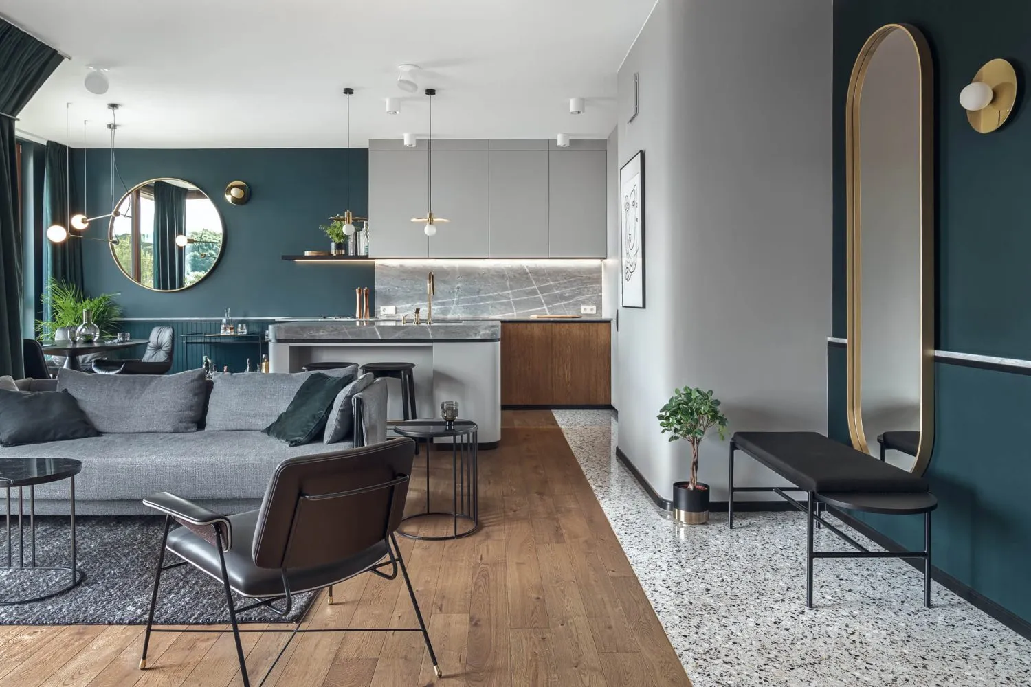 A modern kitchen featuring concrete countertops and minimalist design.