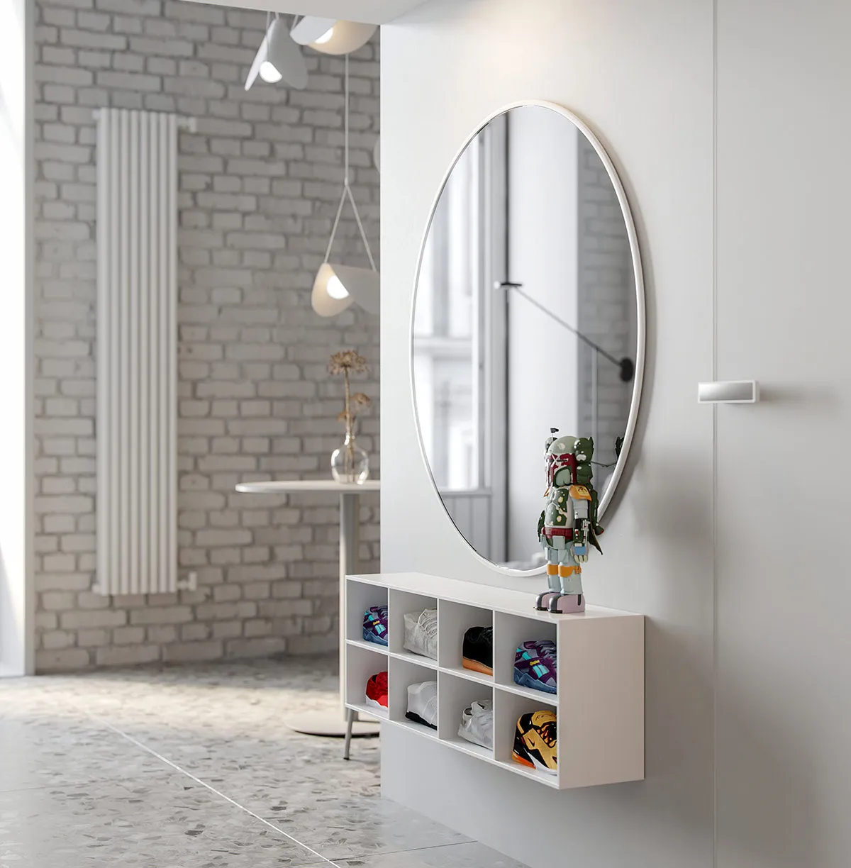 A minimalist entryway featuring concrete walls and flooring, with an oval mirror and a shoe rack below it.