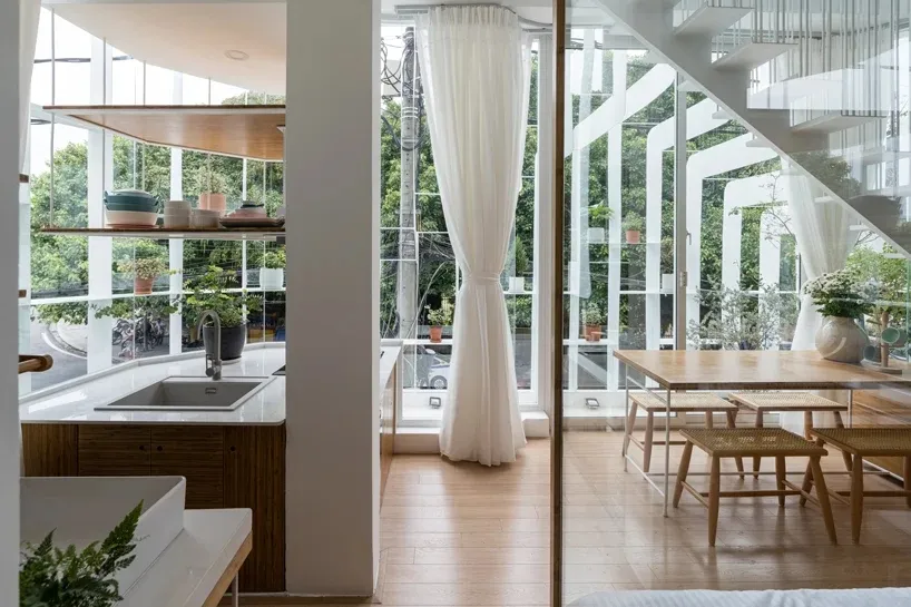 A modern dining room with contemporary wooden materials and a minimalist design.