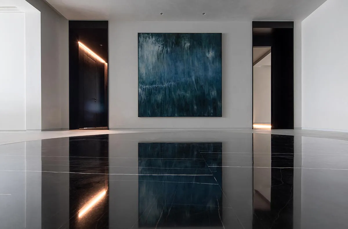 A modern lobby with concrete walls and floors.