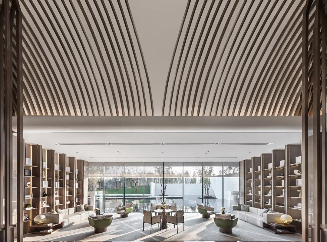 A contemporary minimalist hotel lounge featuring modern furniture and a sleek design.