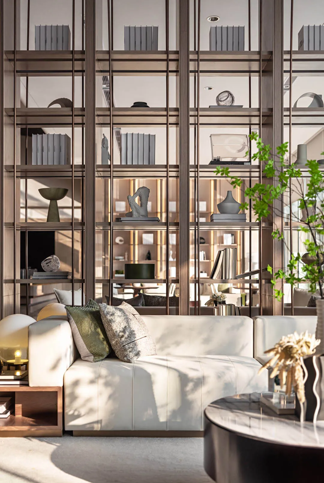 Modern living room with a white sofa, wooden shelves, and decorative items.