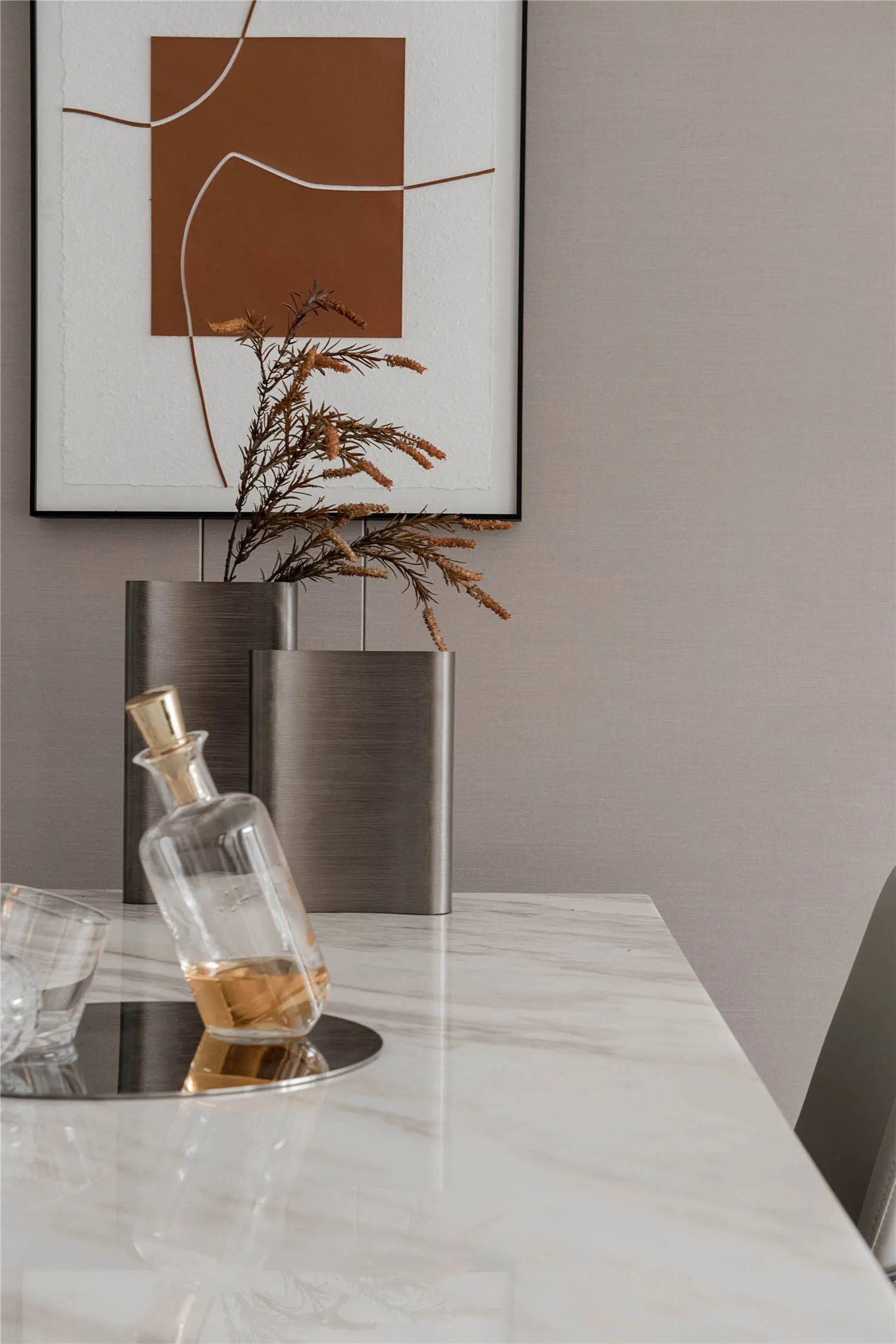 Modern dining room with marble table and minimalist decor.