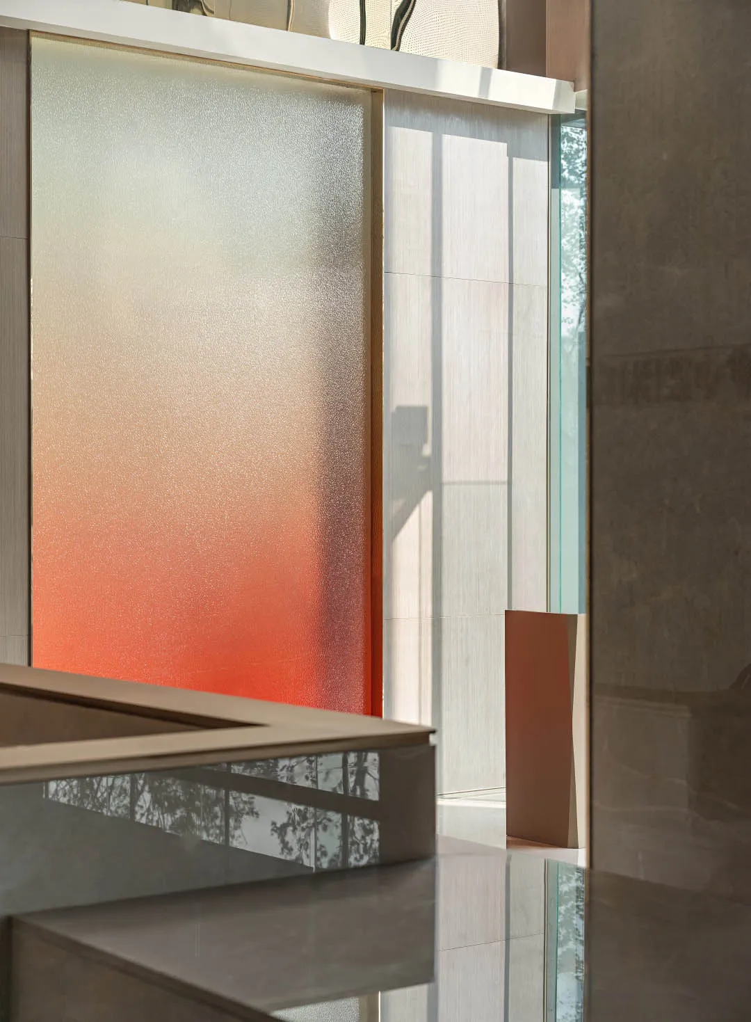 A modern bathroom featuring a glass partition and a sleek, minimalist design.