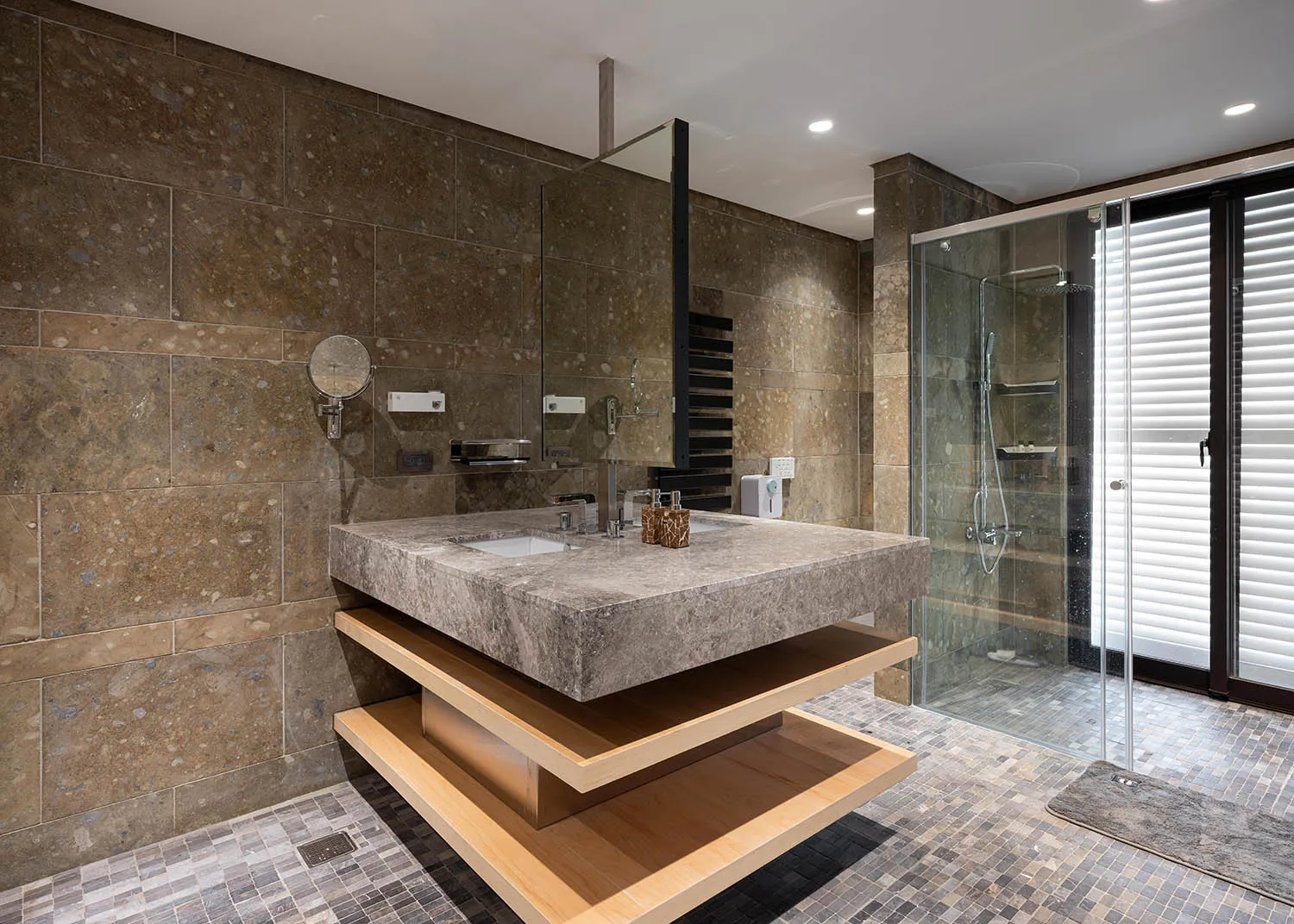 Modern bathroom with stone and concrete materials