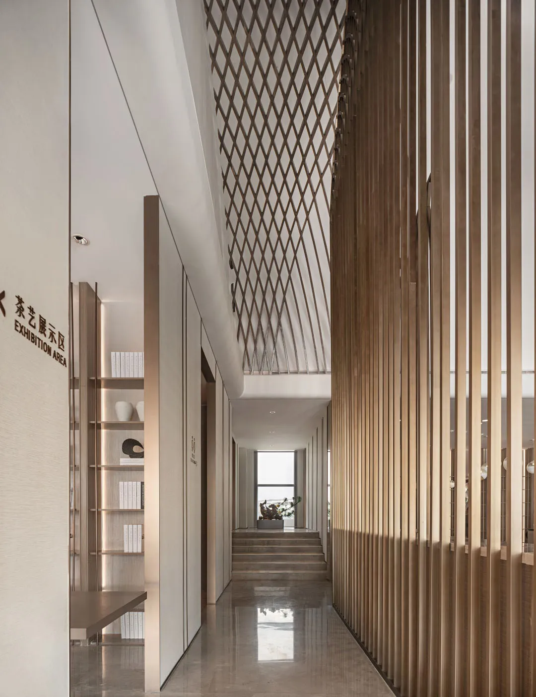 Modern interior design featuring a corridor with wooden slats, concrete flooring, and metal accents.