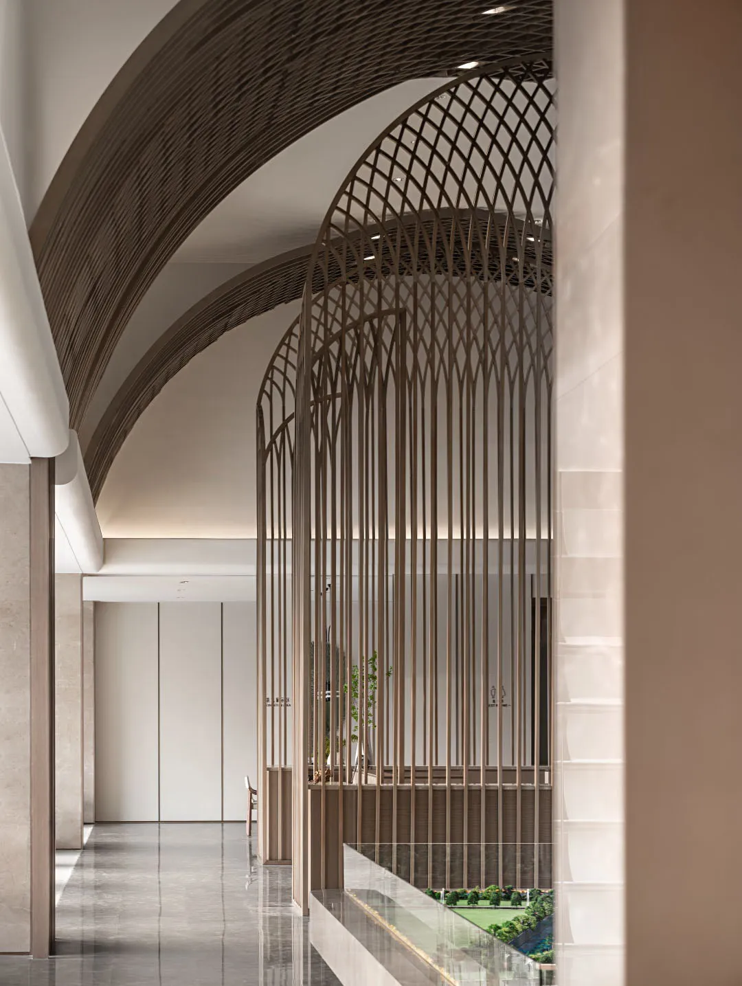Modern space interior featuring metallic grid materials, depicting sleek, contemporary design.