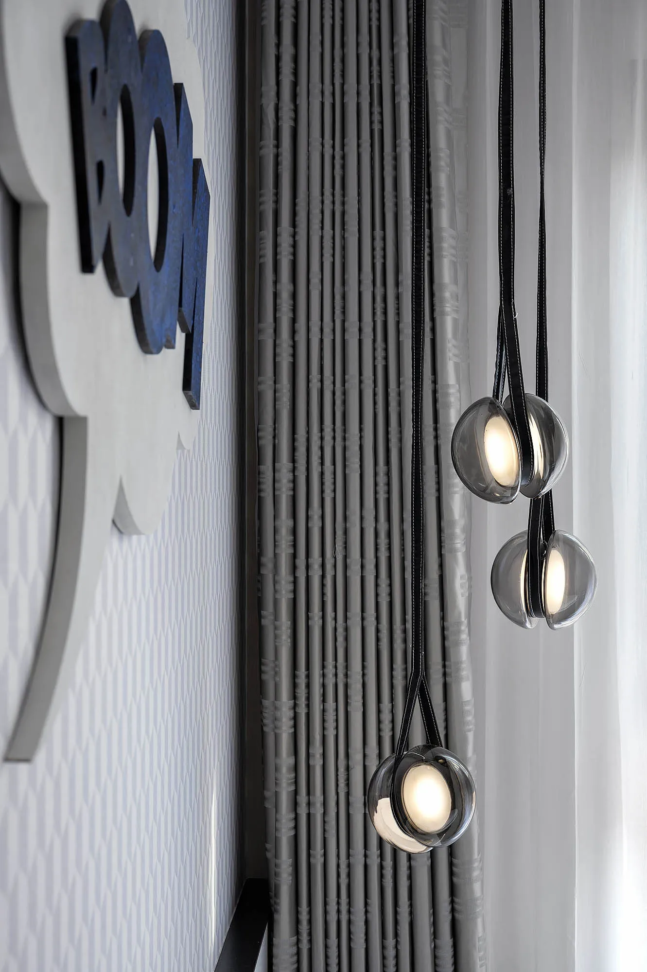 Modern interior design featuring luxury hanging glass lighting fixtures.