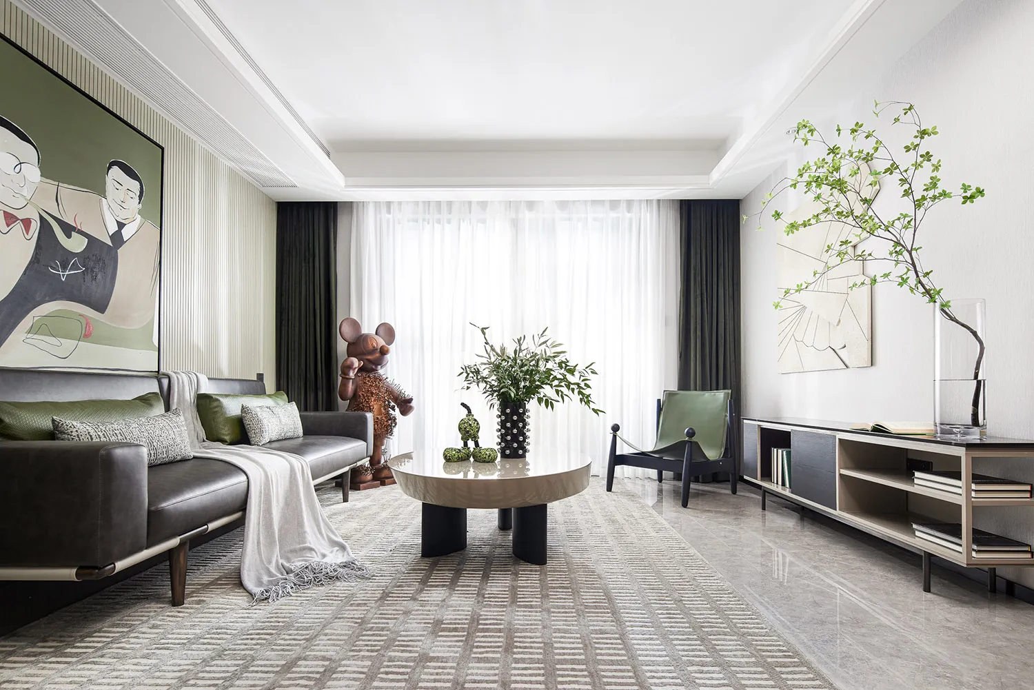 Modern lounge area featuring furniture with concrete, glass, and leather finishes.