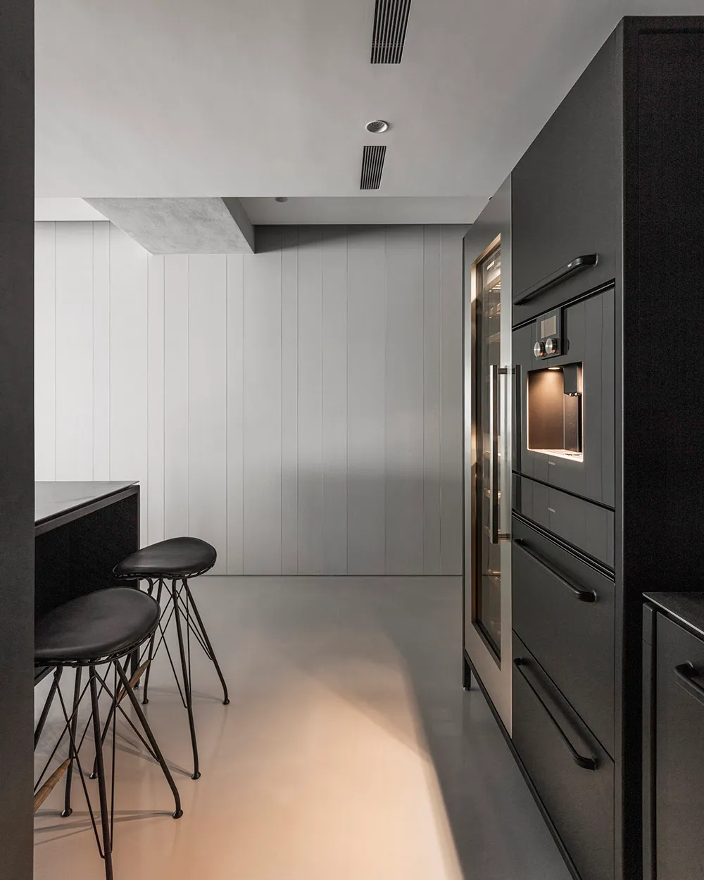 Modern residential kitchen featuring sleek concrete and minimalist design.