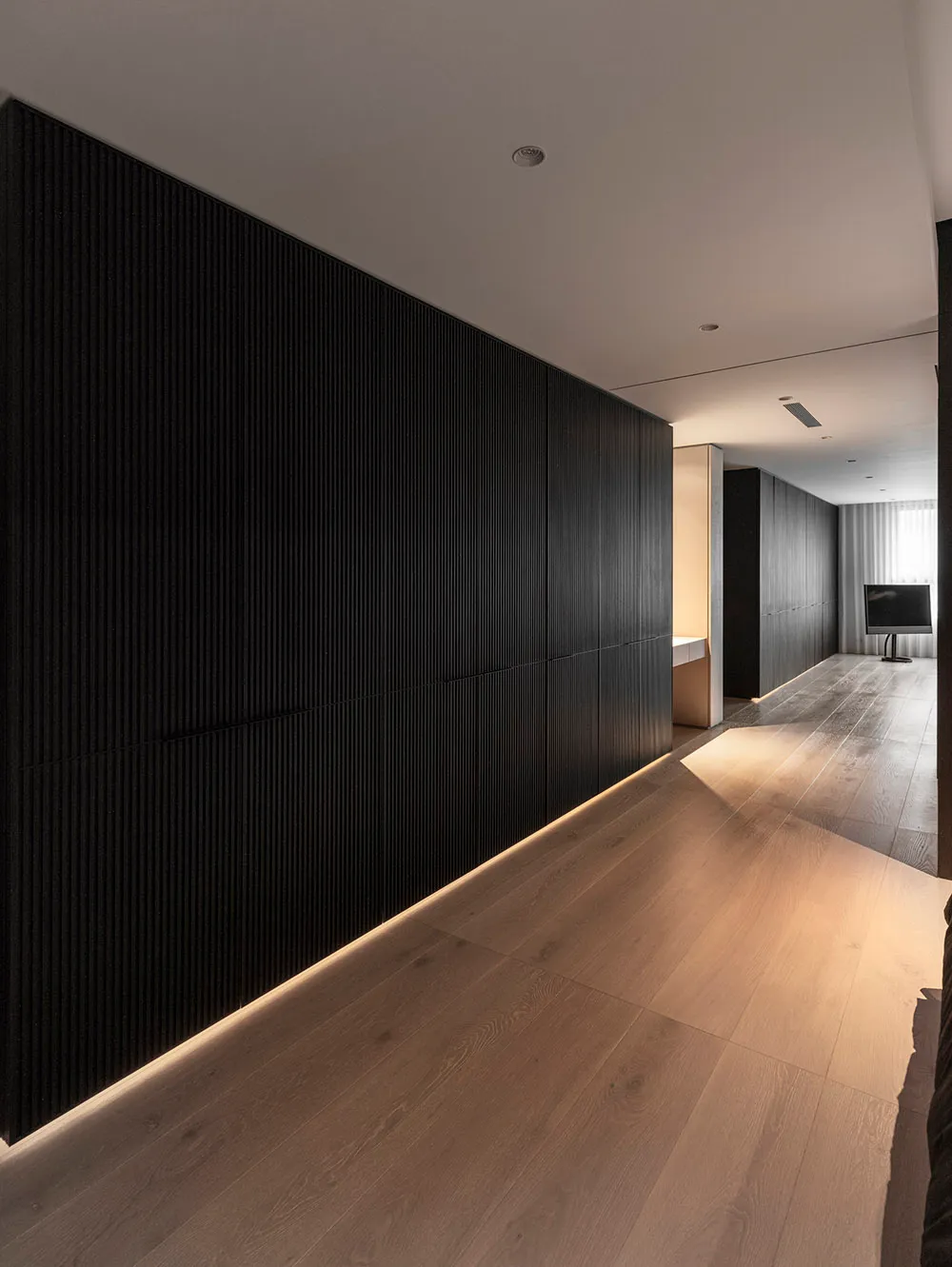 A modern minimalist interior designed with wooden elements.