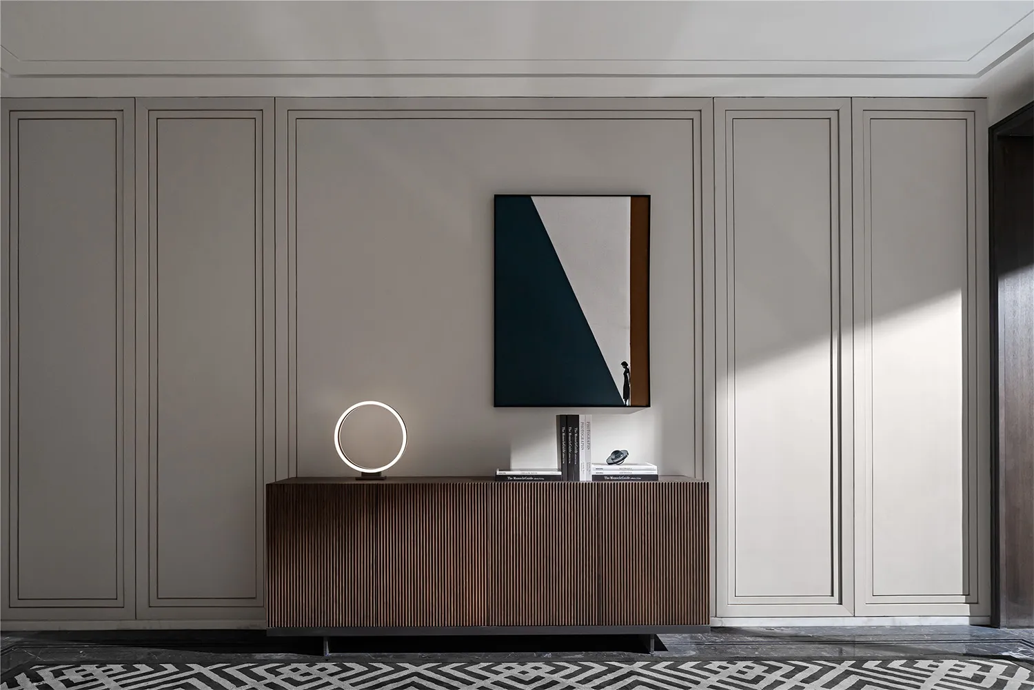 A modern interior design featuring a console table with wood finish in a living room setting.