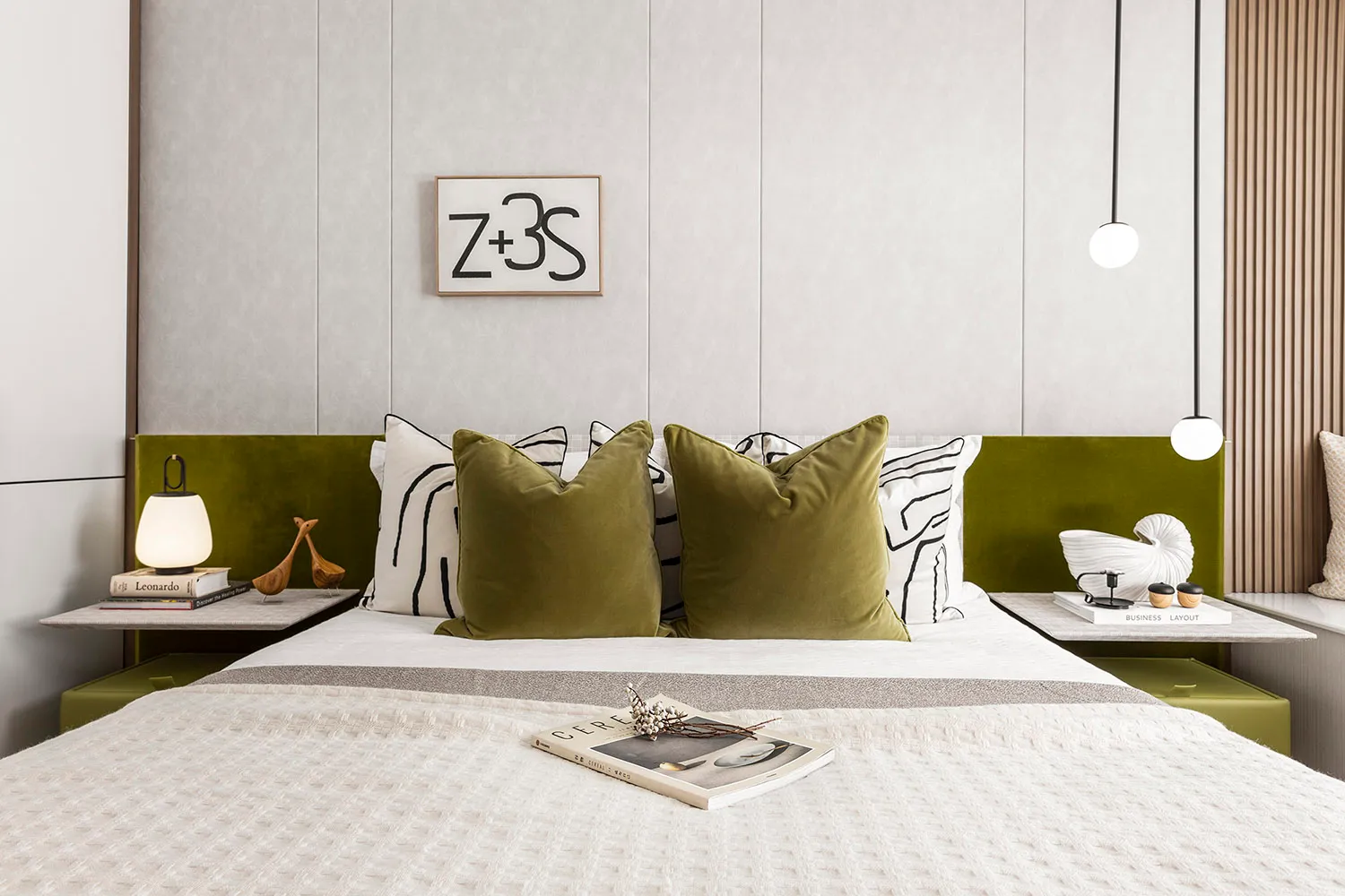 A modern minimalist bedroom featuring a bed with a green and white headboard, white bedding, and decorative pillows.