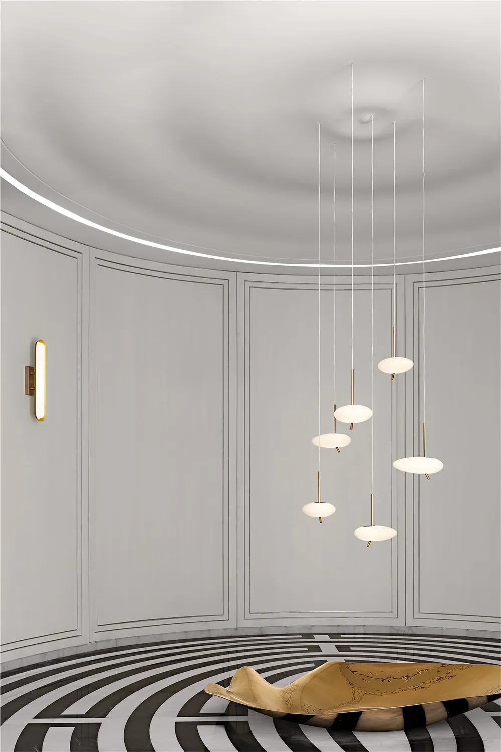 Modern, round room featuring geometric lighting fixtures and a unique floor pattern.