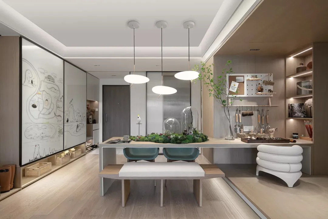 Modern, minimalist kitchen featuring contemporary furniture and clean lines with a touch of greenery.