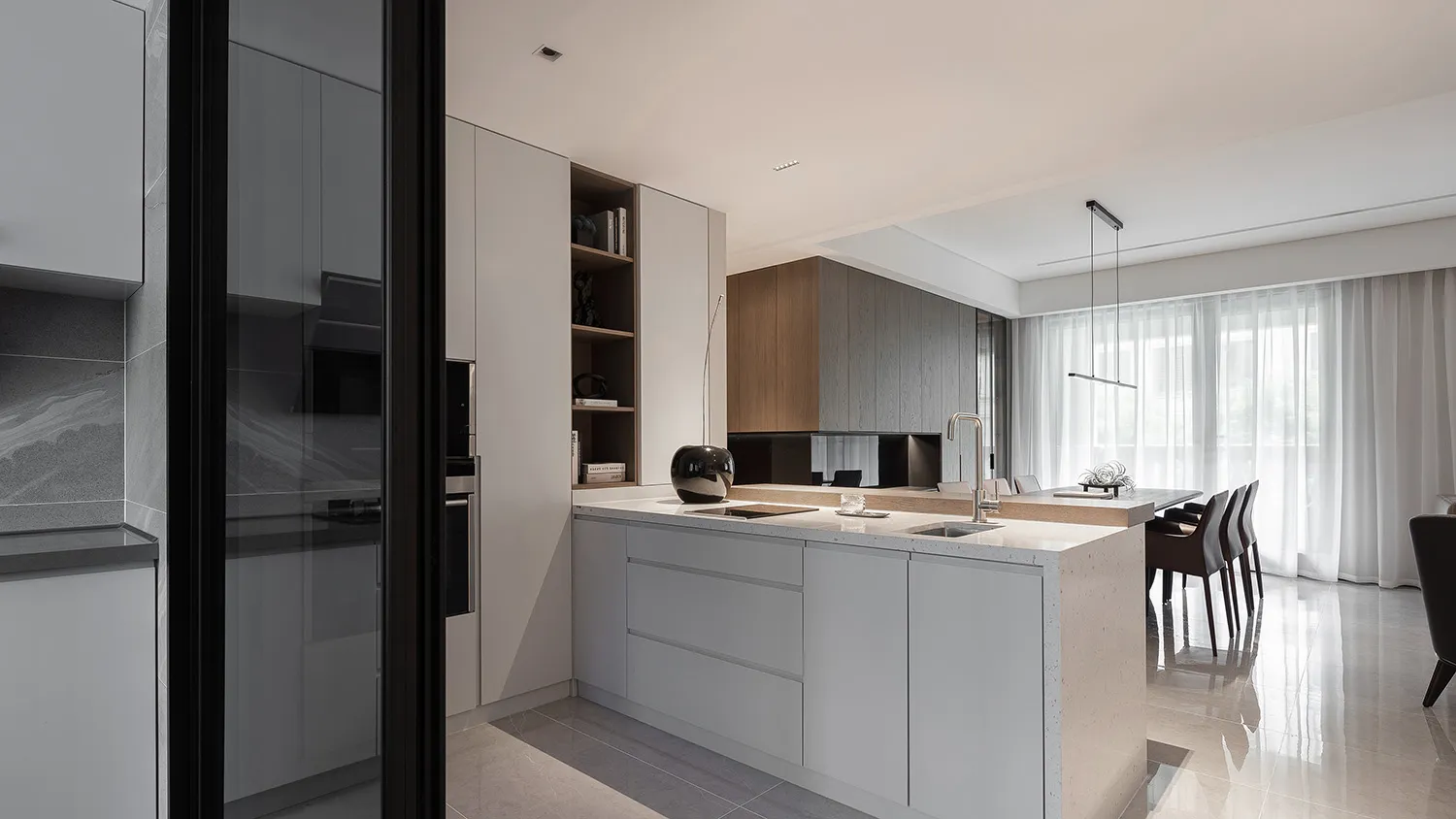 Contemporary minimalist kitchen featuring metallic, glass, and wooden surfaces and finishes.