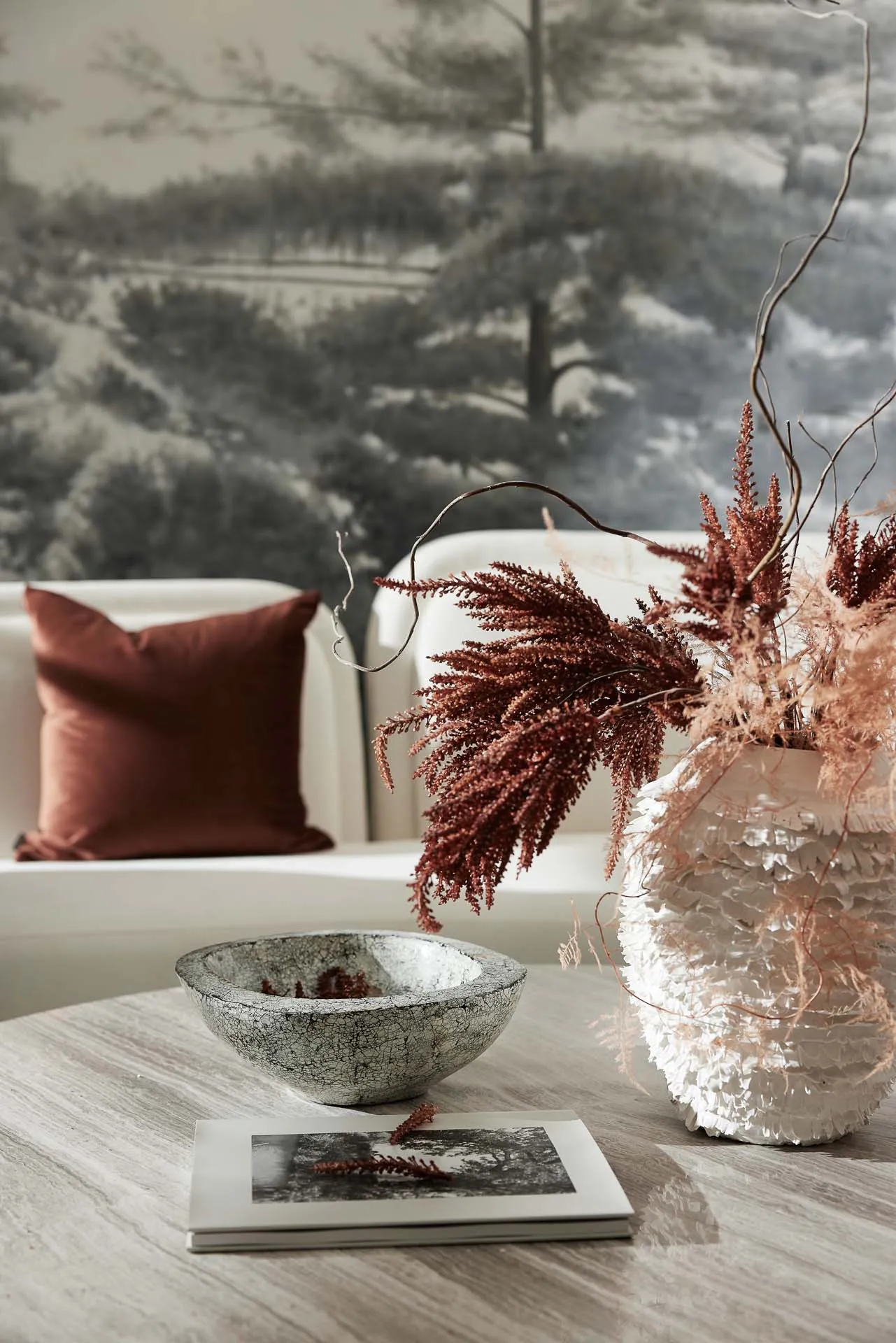 A modern living room with natural, textured elements and a cozy atmosphere.