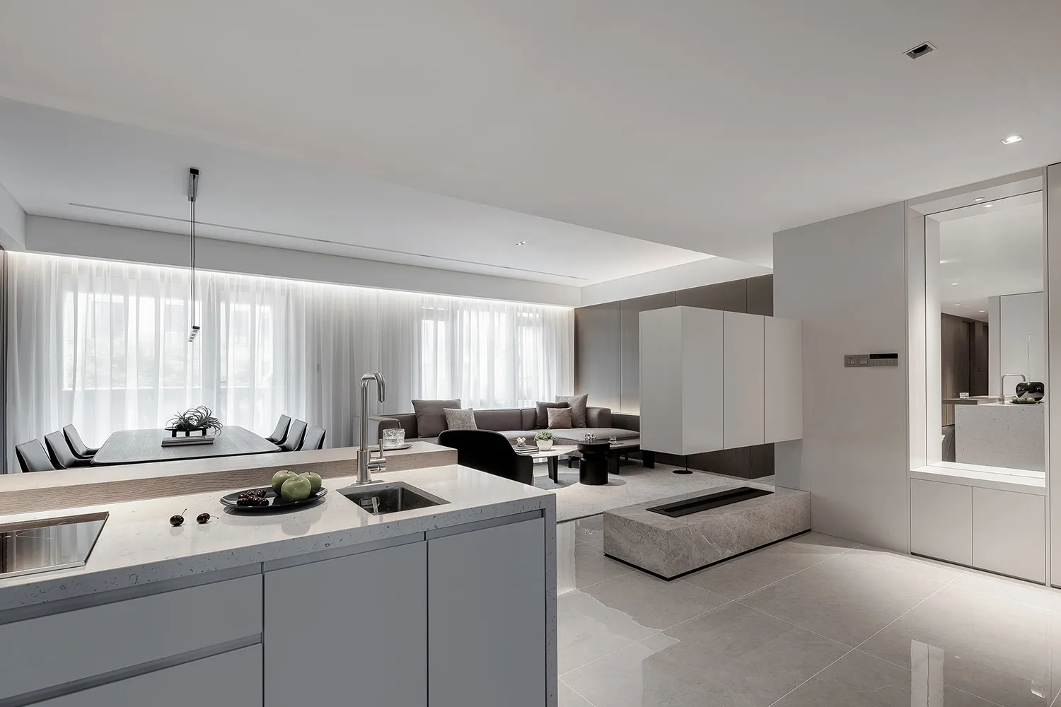Modern minimalist living room with concrete elements and white curtains.