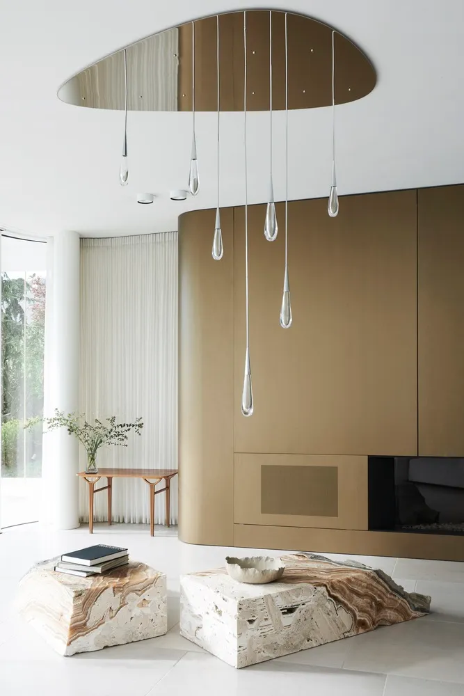 Modern minimalist living room featuring a stylish marble coffee table and abstract block accents.