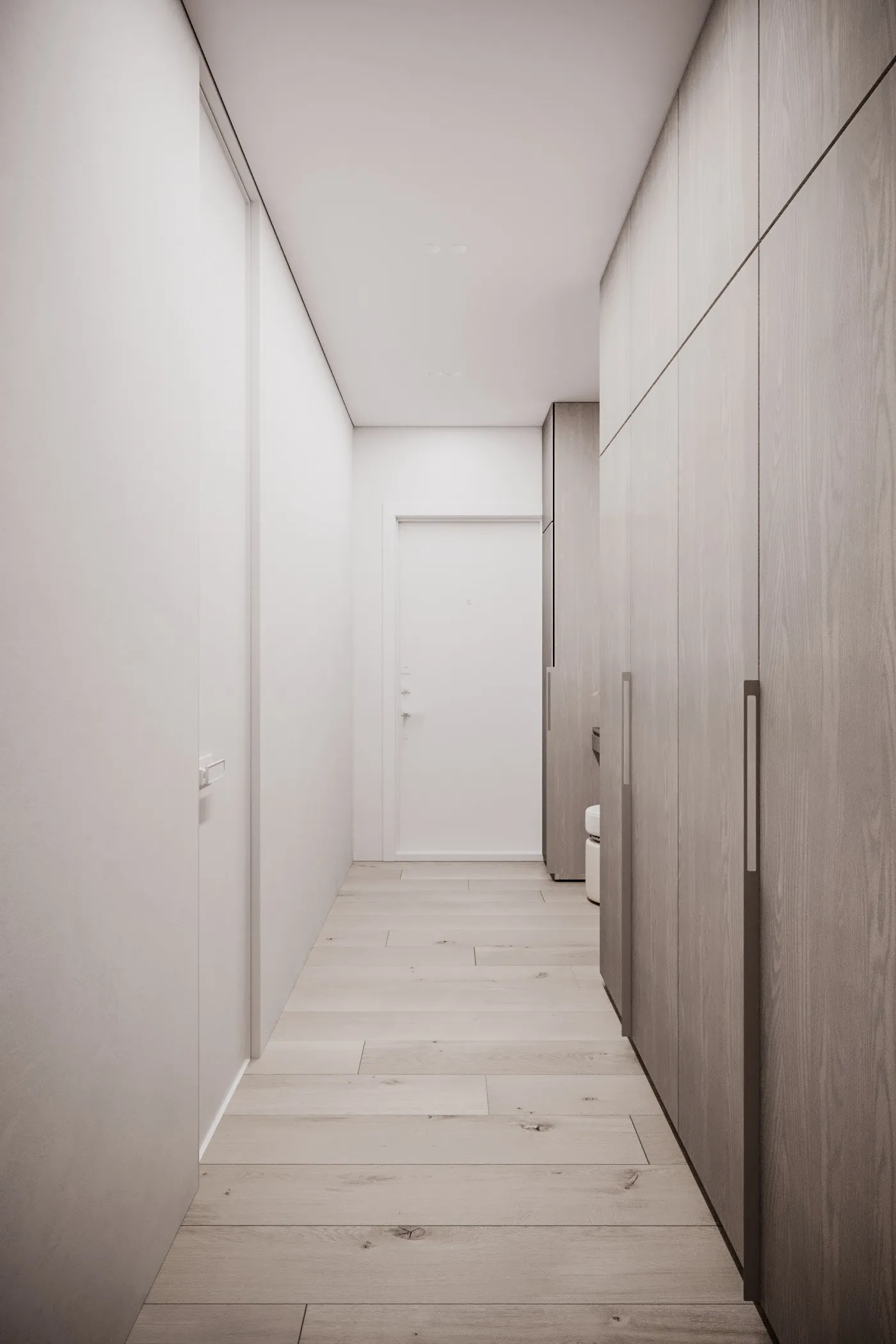 Modern minimalist hallway with wooden flooring and white walls, leading to a door.