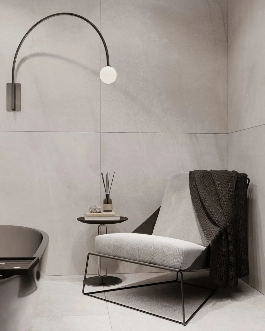 A modern, minimalist home interior featuring concrete walls, a metal-framed chair, and a curved light fixture.