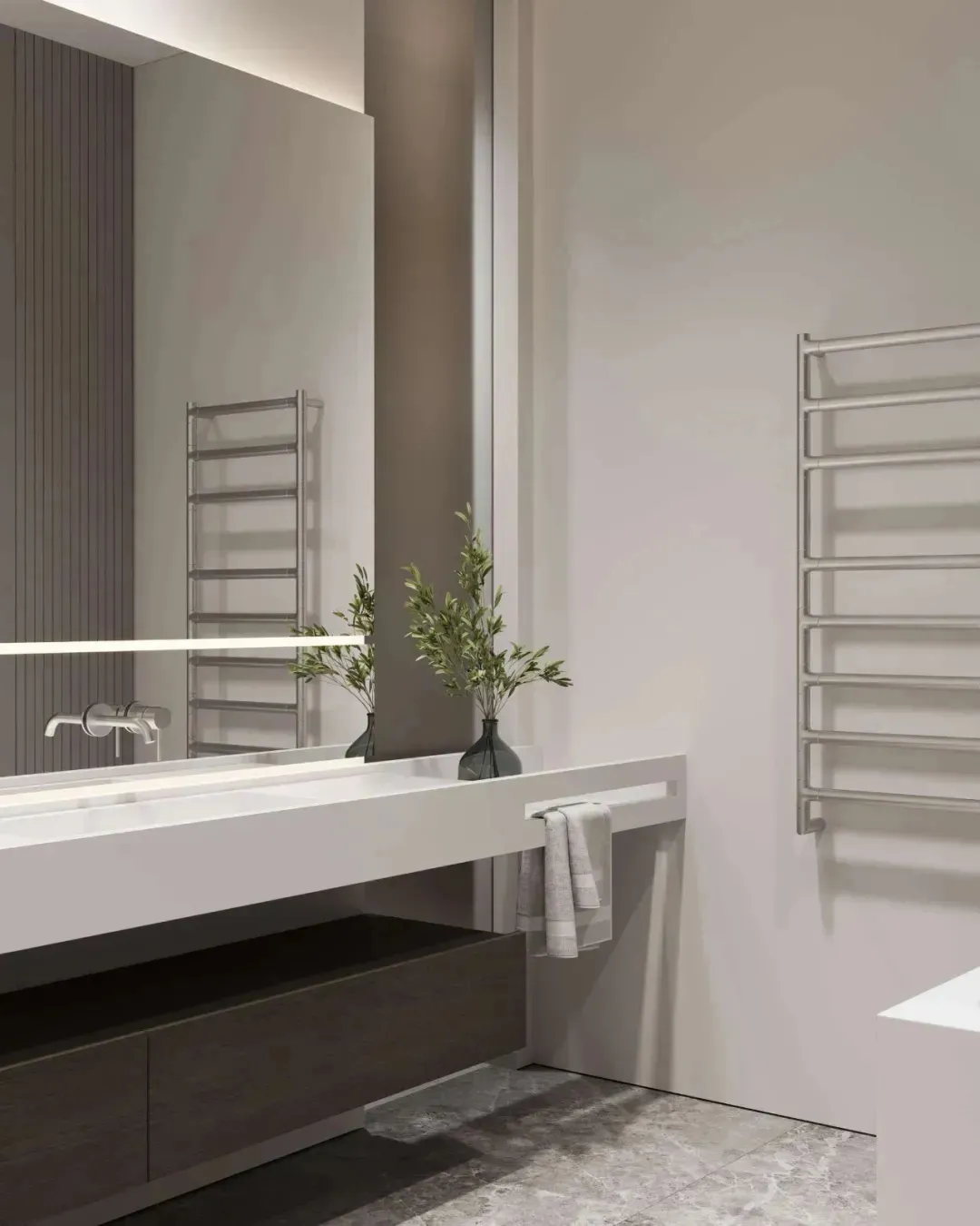 Modern minimalist bathroom interior featuring glass vanity and stainless steel towel rack.