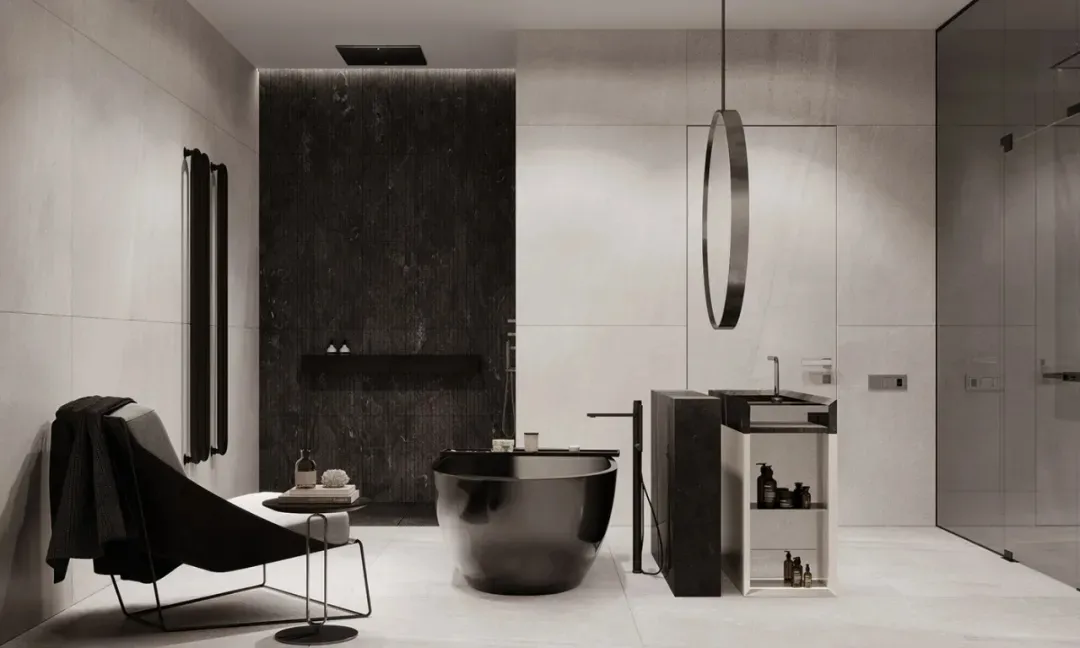 Modern bathroom featuring a black freestanding bathtub, white marble floor, and black marble walls