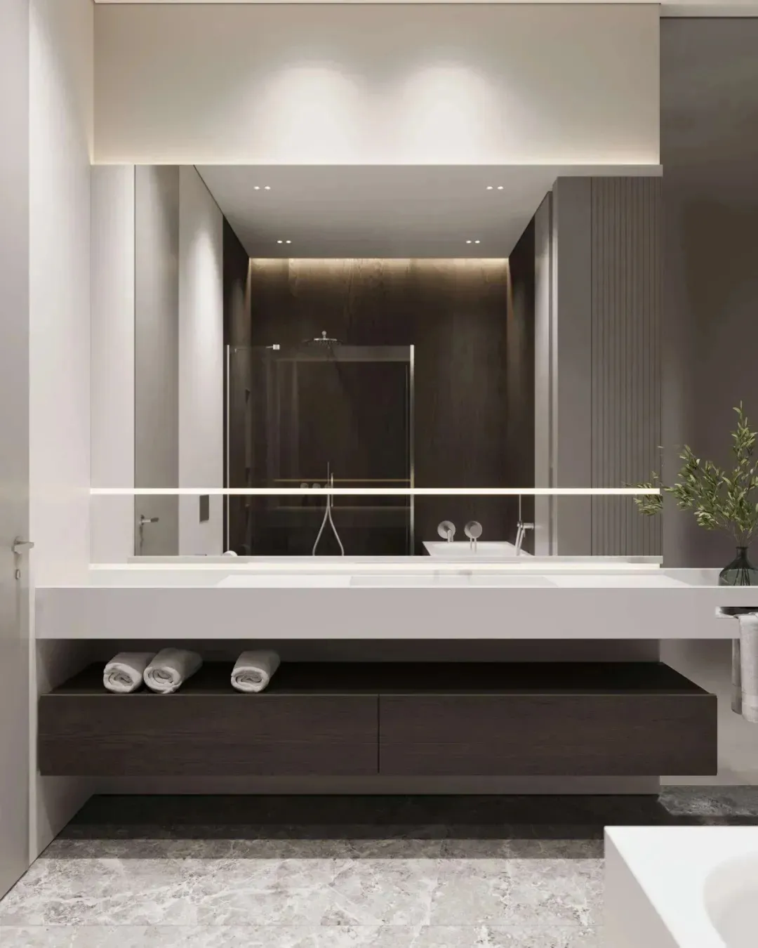 Modern, minimalist bathroom with a floating vanity, glass shower enclosure, and sleek, dark wood cabinetry underneath.