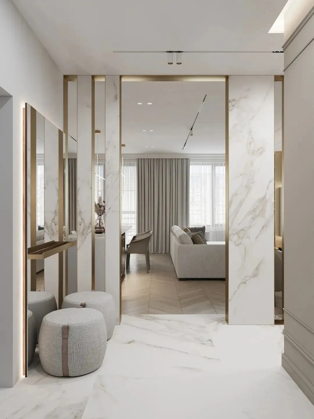 Modern living room with white marble walls and floor, featuring a sofa and chairs.