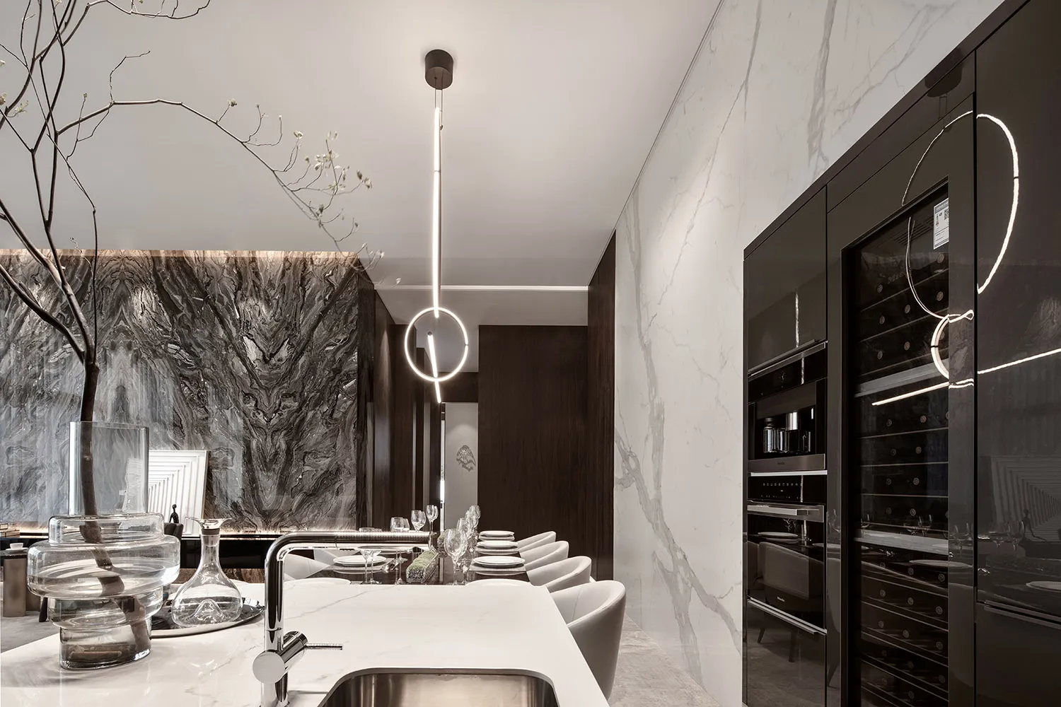 Modern kitchen featuring a marble backsplash and countertop