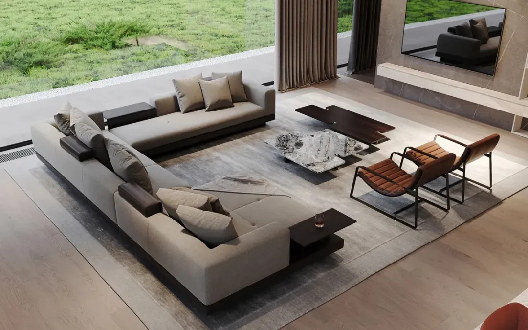 A minimalist living room featuring a large U-shaped sofa upholstered in fabric with a marble coffee table and wooden chairs.