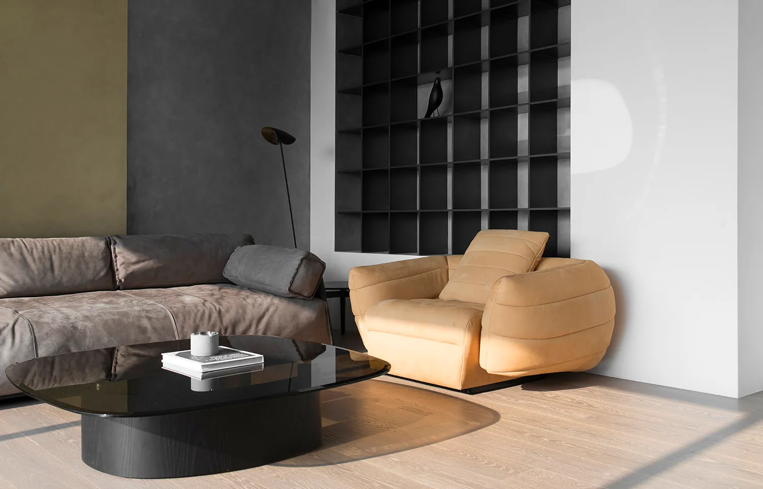 A modern living room with a yellow sofa, dark gray sofa, and black coffee table.
