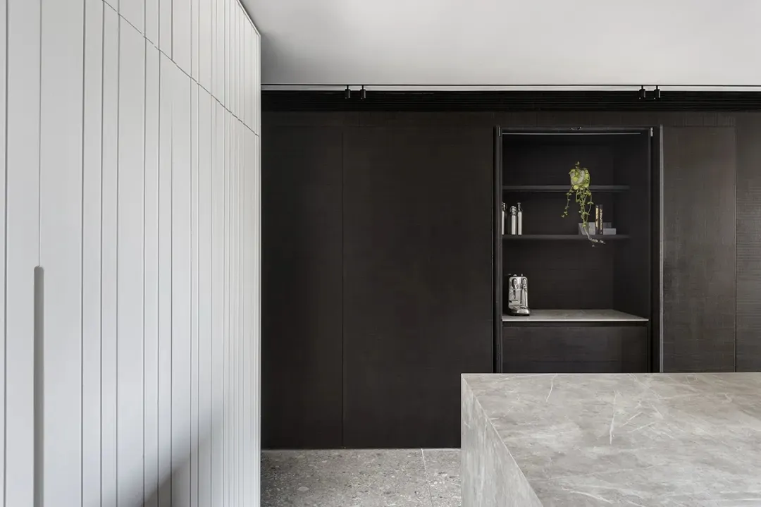 An image of a modern minimalist interior featuring wood and marble materials.