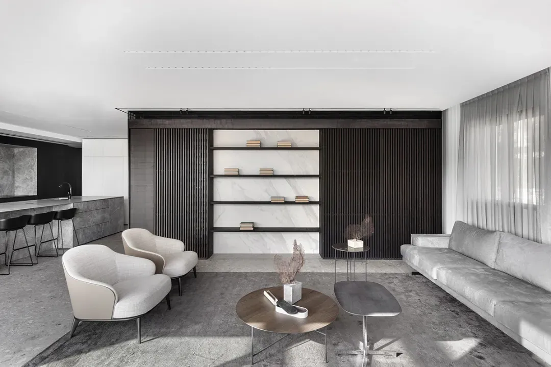 Contemporary living room featuring marble, wood, and concrete elements.
