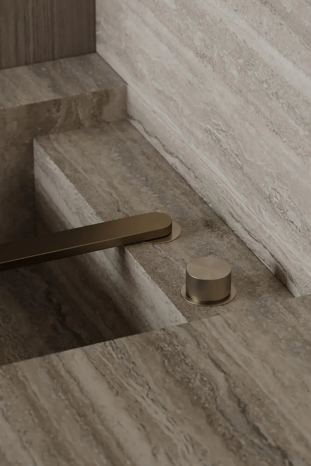 A minimalist bathroom featuring marble surfaces.
