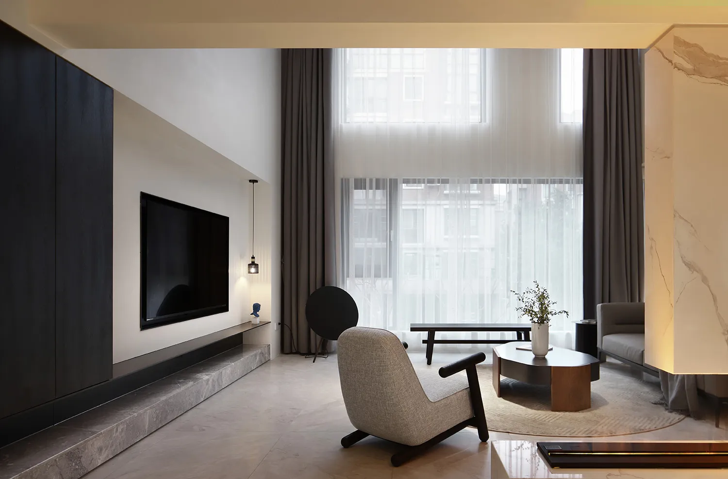 Modern, minimalist living room interior with contemporary furniture and design elements.