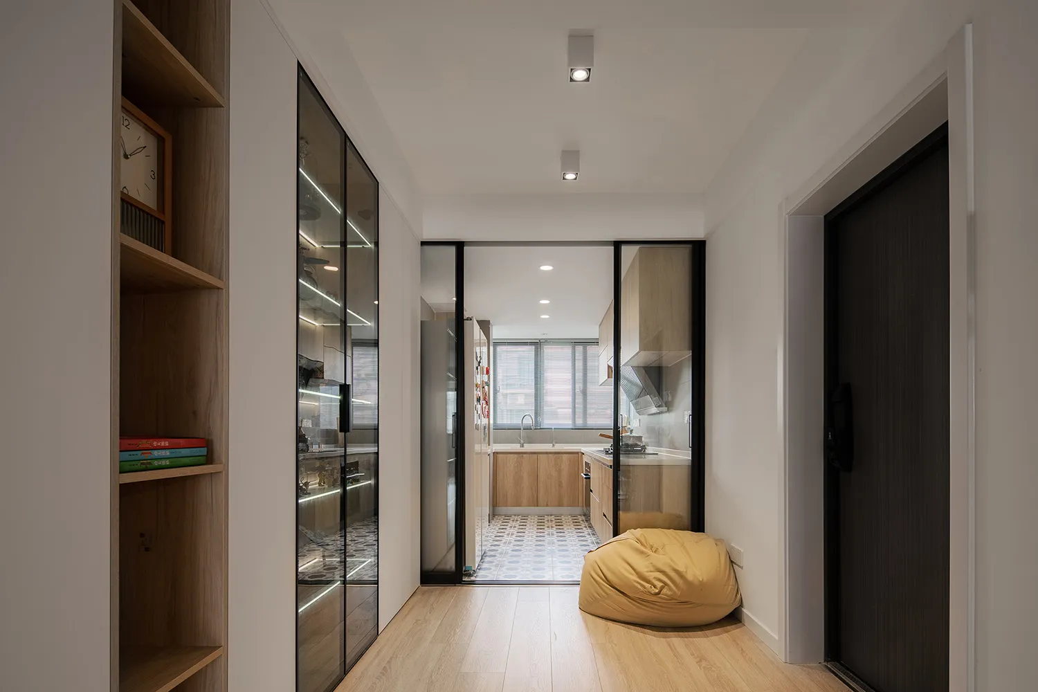 Modern minimalist residential interior with wooden and glass elements.