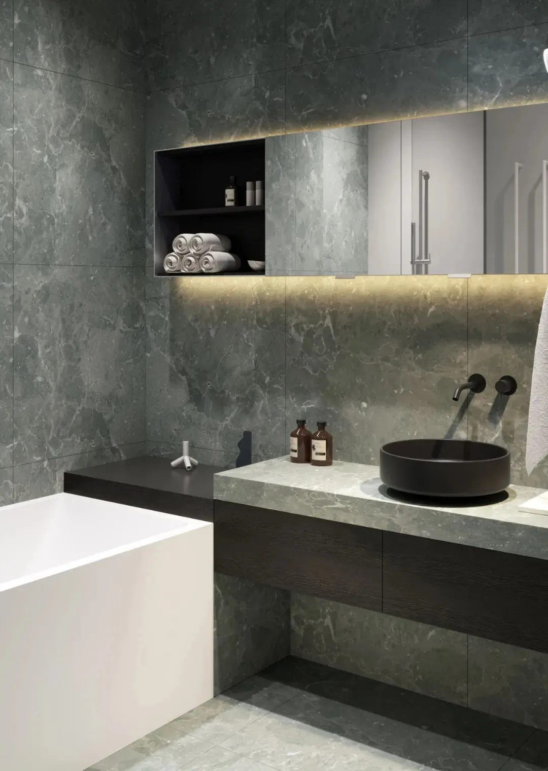 A modern minimalist bathroom featuring a white bathtub and a black countertop with a sink and a shelf with towels and toiletr